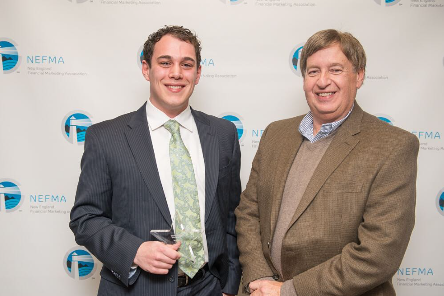 John Cournoyer receiving NEFMA's "Rising Star" Award in 2016. Pictured with Andrew Davis (right), CEO of Davis Advertising